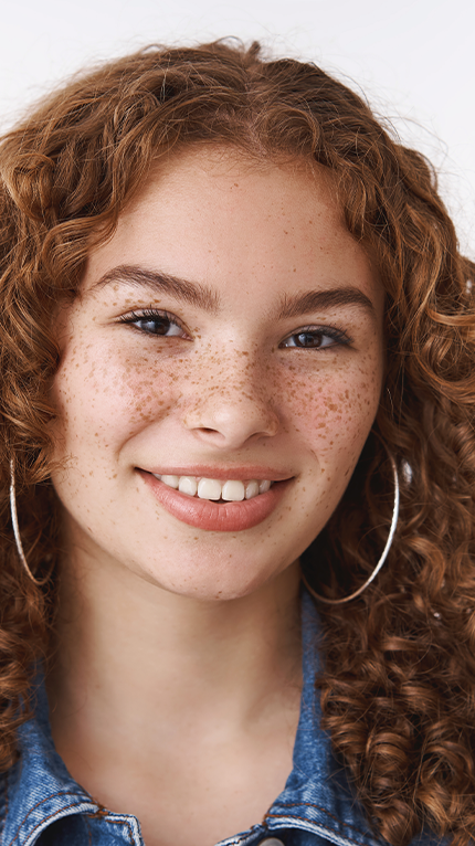 red head with curls and freckles