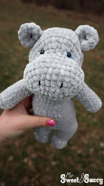 crochet hippo looking down on it