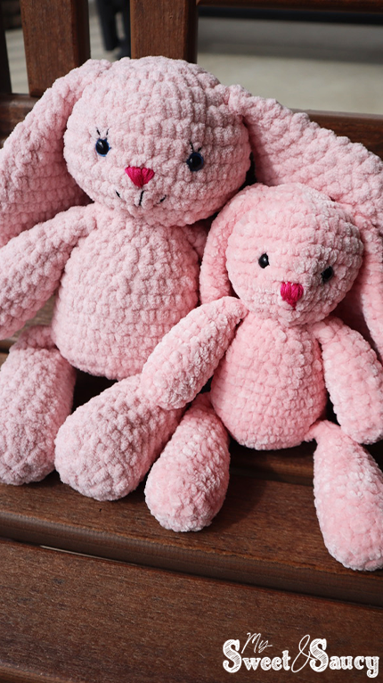 two crochet bunnies on a chair