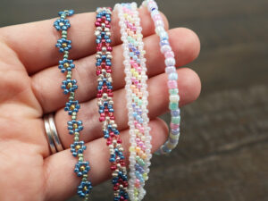 four types of seed bead bracelets on my hand